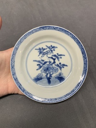 Five Chinese caf&eacute;-au-lait-ground blue and white cups and four saucers, conical shell mark, Kangxi