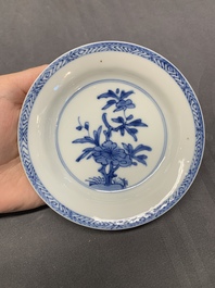 Five Chinese caf&eacute;-au-lait-ground blue and white cups and four saucers, conical shell mark, Kangxi