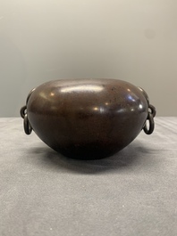 A Chinese bronze water pot with 'Taotie' handles, Xuande mark, 17/18th C.