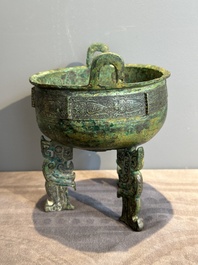 A rare Chinese archaic bronze tripod ritual food vessel, 'ding 鼎', Shang