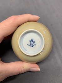 Five Chinese caf&eacute;-au-lait-ground blue and white cups and four saucers, conical shell mark, Kangxi