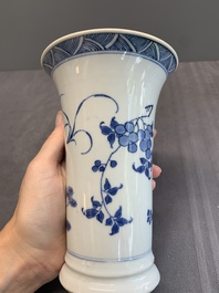 A pair of Chinese blue and white beaker vases with floral sprigs, Transitional period