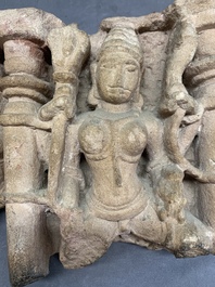 An Indian architectural red sandstone fragment with divinities, 13th C.