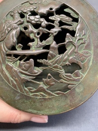 A rare Chinese bronze 'sage in a mountainous landscape' handwarmer, 17/18th C.