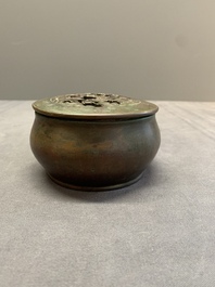 A rare Chinese bronze 'sage in a mountainous landscape' handwarmer, 17/18th C.