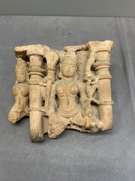 An Indian architectural red sandstone fragment with divinities, 13th C.