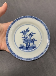 Five Chinese caf&eacute;-au-lait-ground blue and white cups and four saucers, conical shell mark, Kangxi