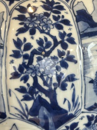 A Chinese blue and white vase and cover with landscapes and flowers, Kangxi