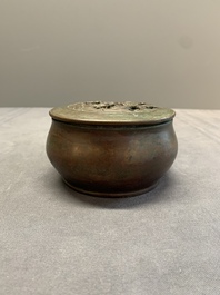 A rare Chinese bronze 'sage in a mountainous landscape' handwarmer, 17/18th C.