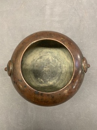 A Chinese bronze water pot with 'Taotie' handles, Xuande mark, 17/18th C.