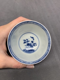 Five Chinese caf&eacute;-au-lait-ground blue and white cups and four saucers, conical shell mark, Kangxi