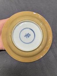 Five Chinese caf&eacute;-au-lait-ground blue and white cups and four saucers, conical shell mark, Kangxi