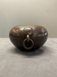 A Chinese bronze water pot with 'Taotie' handles, Xuande mark, 17/18th C.
