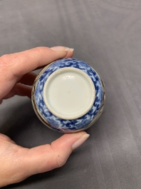 A Chinese export famille rose cup and saucer with a herring merchant, Qianlong
