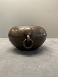 A Chinese bronze water pot with 'Taotie' handles, Xuande mark, 17/18th C.