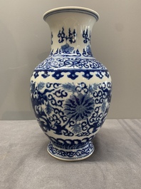 A Chinese blue and white 'phoenix and flower scroll' vase, Qianlong mark, 19th C.