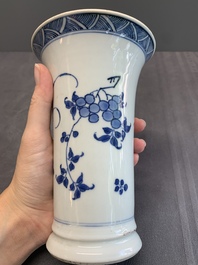 A pair of Chinese blue and white beaker vases with floral sprigs, Transitional period