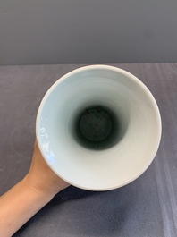 A pair of Chinese blue and white beaker vases with floral sprigs, Transitional period