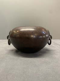 A Chinese bronze water pot with 'Taotie' handles, Xuande mark, 17/18th C.