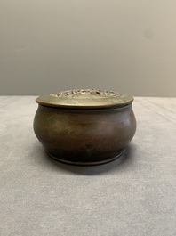 A rare Chinese bronze 'sage in a mountainous landscape' handwarmer, 17/18th C.