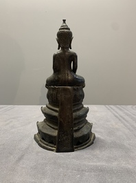 A Laotian bronze figure of a seated Buddha, 19th C.