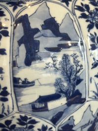 A Chinese blue and white vase and cover with landscapes and flowers, Kangxi