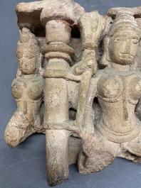 An Indian architectural red sandstone fragment with divinities, 13th C.