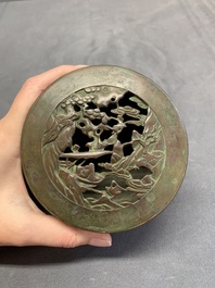 A rare Chinese bronze 'sage in a mountainous landscape' handwarmer, 17/18th C.