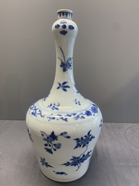 A Chinese blue and white bottle vase with floral sprigs, Transitional period