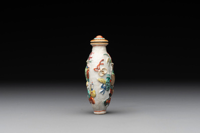 A Chinese molded famille rose 'antiquities' snuff bottle and porcelain stopper, Qianlong mark, 19th C.