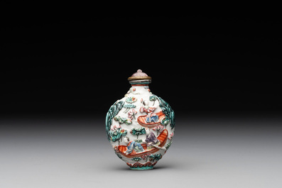 A Chinese famille rose relief-molded snuff bottle with an animated river landscape, Jiaqing mark and of the period