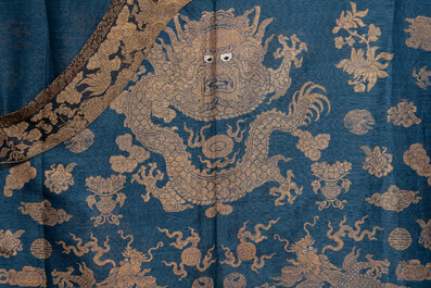 A Chinese embroidered silk blue-ground summer gauze 'nine dragons' robe, 19th C.