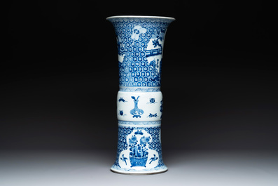 A Chinese blue and white 'gu' vase with a lady and antiquities, Kangxi