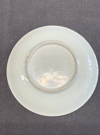 A Dutch-decorated Chinese porcelain cup and saucer with figures in a landscape, 18th C.