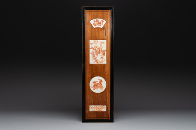 A Chinese four-part folding screen with iron-red-decorated porcelain plaques, 19/20th C.