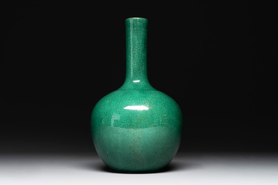 A Chinese apple-green-glazed and two copper-red-glazed bottle vases, Kangxi mark, 19/20th C.