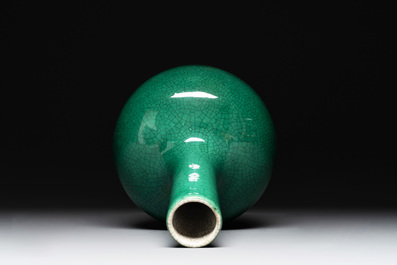A Chinese apple-green-glazed and two copper-red-glazed bottle vases, Kangxi mark, 19/20th C.
