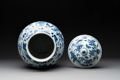A pair of Chinese blue and white vases and covers with figural panels, 19th C.
