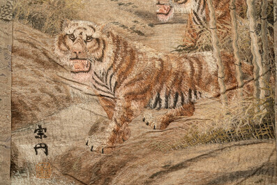 A Japanese embroidered silk wall tapestry with two tigers, Meiji, 19th C.