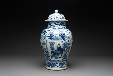 A pair of Chinese blue and white vases and covers with figural panels, 19th C.