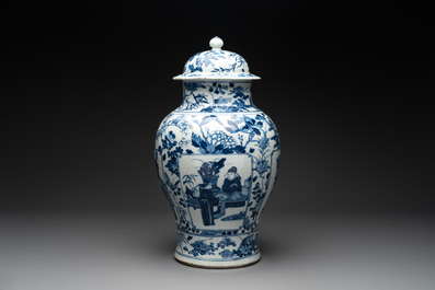 A pair of Chinese blue and white vases and covers with figural panels, 19th C.