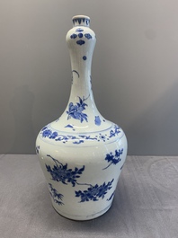 A Chinese blue and white bottle vase with floral sprigs, Transitional period