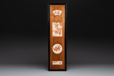 A Chinese four-part folding screen with iron-red-decorated porcelain plaques, 19/20th C.