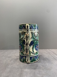 A polychrome Iznik-style mug with tulips and carnations, Kutahya, Turkey, 19th C.