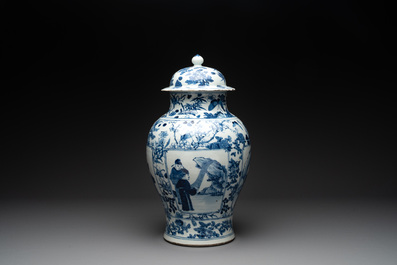 A pair of Chinese blue and white vases and covers with figural panels, 19th C.