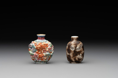 A Chinese famille rose molded 'Buddhist lions' and a grisaille 'dragon' snuff bottle, Qianlong and Daoguang mark, 19th C.