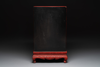 A Chinese cinnabar lacquer 'mountainous landscape' cabinet on a stand, 19th C.