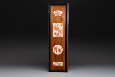 A Chinese four-part folding screen with iron-red-decorated porcelain plaques, 19/20th C.