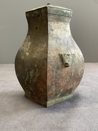 A Chinese bronze ritual wine vessel and cover, 'fang hu 方壺', Warring States Period