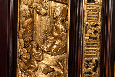 A Chinese four-part reticulated and partially gilt wooden folding screen, 19th C.